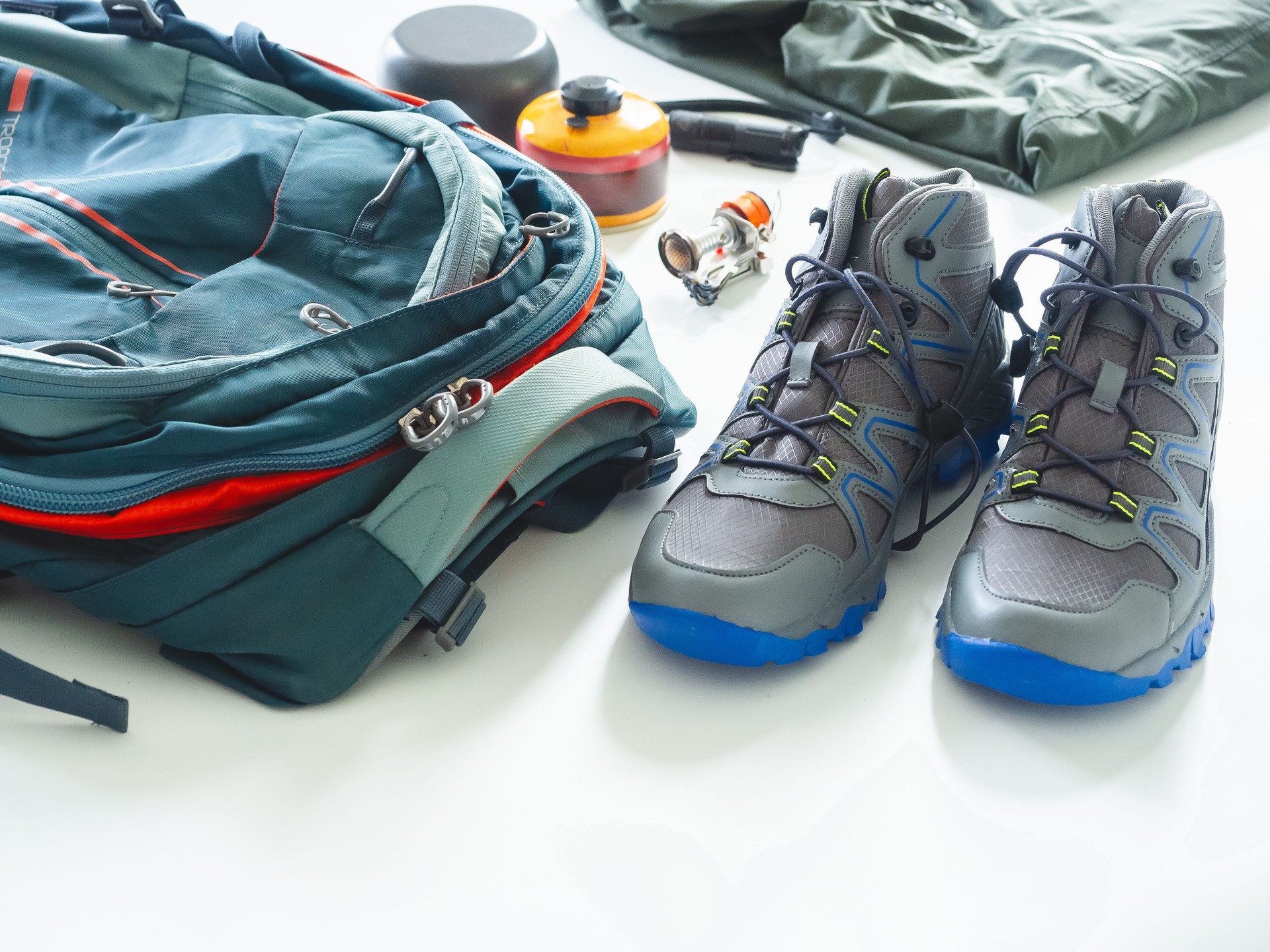 Hiking gear and camping equipment for travel on white background